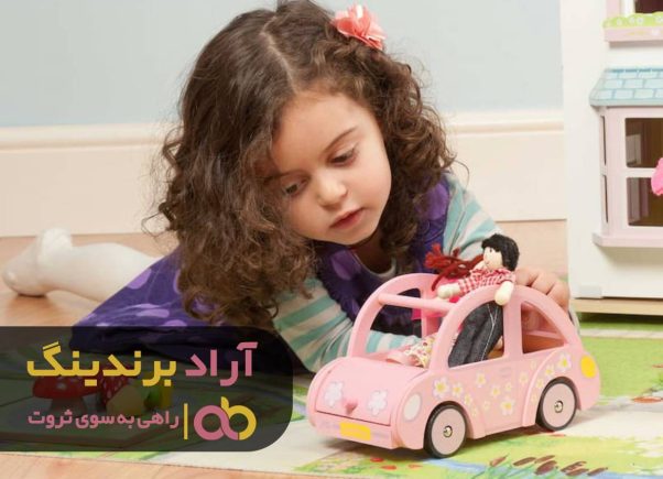 A child playing with a toy car

Description automatically generated with medium confidence